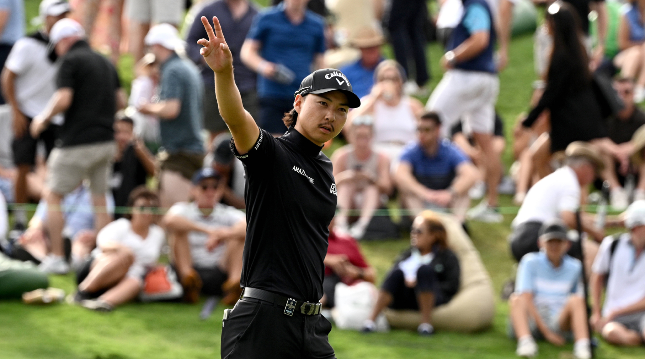 Min Woo Lee gestures to fans at the 2023 Australian Open.